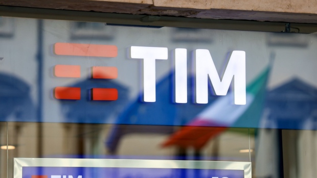 The Telecom Italia SpA logo in the window of a store in Rome.