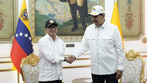 Nicolas Maduro, Venezuela’s president, right, and Gustavo Petro, Colombia’s president, shake hands at Miraflores Palace in Caracas, Venezuela, on Tuesday, April 9, 2024. 