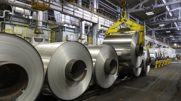 <p>A hoist lowers an aluminium roll onto a storage platform at the Sayanal foil mill in Sayanogorsk, Russia.</p>