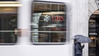 A tram passes the UBS headquarters in Zurich. Photographer: Pascal Mora/Bloomberg