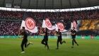 <p>Eintracht Frankfurt flags are paraded on the pitch prior to a match.</p>