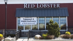 A banner saying “Open For Takeout & Free Delivery” hangs outside a Red Lobster restaurant at The Plaza at Harmon Meadow in Secaucus, New Jersey, U.S., on Thursday, April 2, 2020.