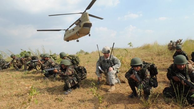 Philippine and US soldiers during a joint military exercise. Photographer: Ted Aljibe/AFP/Getty Images