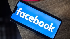 <p>The Facebook logo on a smartphone.</p>