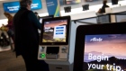 <p>Alaska Air Group Inc. self check-in kiosks at San Francisco International Airport.</p>