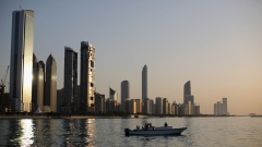 Abu Dhabi skyline at sunset.