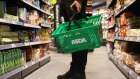 A shopper at an Asda Express convenience store in London. Photographer: Hollie Adams/Bloomberg