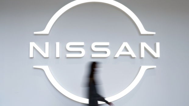 The Nissan Motor Co. logo in a showroom at the company's global headquarters in Yokohama, Japan, on Tuesday, Nov. 2, 2021. As Japan's biggest carmakers report earnings over the next week, strong demand for vehicles is fueling higher profits that will help offset lower sales volumes caused by parts shortages and production cuts. Photographer: Kiyoshi Ota/Bloomberg