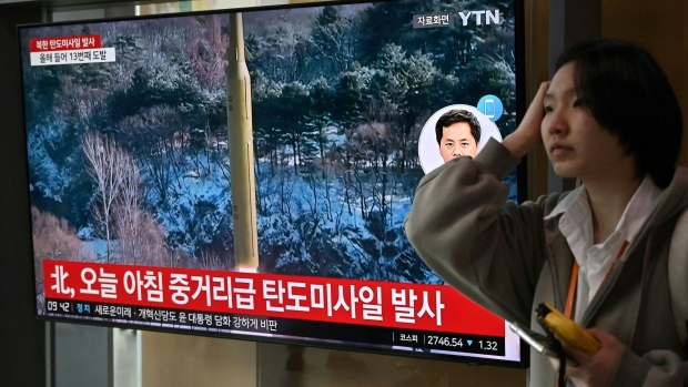 A news broadcast plays file footage of a North Korean missile test, at a railway station in Seoul on April 2. Photographer: Jung Yeon-Je/AFP/Getty Images