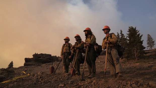 <p>Firefighters wait before performing a controlled burn as a preventative measure in Kirkwood, California.</p>