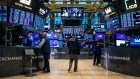 <p>Traders work on the floor of the New York Stock Exchange.</p>