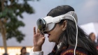 <p>A customer using a Vision Pro headset at an Apple store in Palo Alto, Calif.</p>
