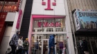 Signage outside a T-Mobile store in New York, US, on Thursday, March 16, 2023. T-Mobile US Inc. is buying Mint Mobile, the budget wireless provider partly owned by actor Ryan Reynolds, for as much as $1.35 billion in an effort to bolster its prepaid phone business and reach more lower-income customers. Photographer: Yuki Iwamura/Bloomberg