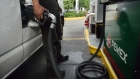 An attendant fuels a taxi at a Petroleos Mexicanos gas station in Mexico City, Mexico.