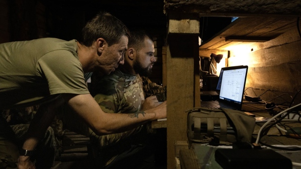 Ukrainian soldiers work in a drone unit command center near Bakhmut.