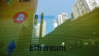 The Bitcoin and Ether logos on a screen in Hong Kong, China, on Wednesday, Dec. 21, 2022. Cryptocurrencies have had a harsh 2022 after reaching record highs late last year, buffeted by everything from the Fed's policy tightening to the implosions of the Terra/Luna ecosystem, hedge funds Three Arrows Capital and exchange FTX. Photographer: Paul Yeung/Bloomberg