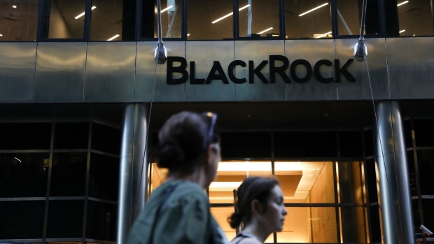 Pedestrians walk past BlackRock Inc. headquarters in New York, U.S, on Wednesday, June 11, 2018. BlackRock Inc. is scheduled to release earnings figures on July 16. Photographer: Bess Adler/Bloomberg