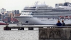 The Viking Sea, an ocean-going cruise ship, passes along the River Thames in London.