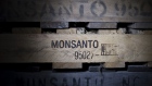 The Monsanto Co. logo is displayed on a pallet at the Crop Protection Services facility in Manlius, Illinois, US. Photographer: Daniel Acker/Bloomberg