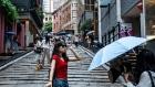 <p>Tourists take pictures at the Soho area in Hong Kong.</p>