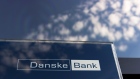 A logo sits on display in the window of a Danske Bank A/S bank branch in Copenhagen, Denmark, on Wednesday, Sept. 19, 2018. Danske Bank A/S Chief Executive Officer Thomas Borgen will step down amid allegations his bank was at the center of a major European money laundering scandal with as much as $234 billion flowing through a tiny unit in Estonia. Photographer: Freya Ingrid Morales/Bloomberg