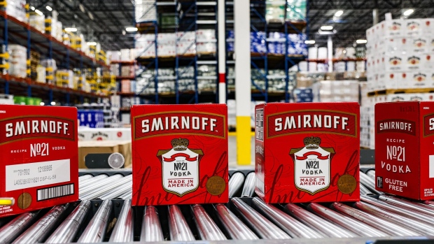 Cases of Diageo Smirnoff vodka on a conveyor belt. Photographer: Valerie Plesch/Bloomberg