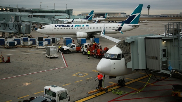 <p>WestJet planes at Toronto Pearson International Airport in Toronto, Ontario, Canada.</p>