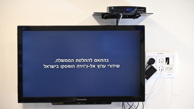 A television with a message broadcasted on the Al Jazeera television network reading "In accordance with the government decision, Al Jazeera channel broadcasts have been suspended in Israel" in Jerusalem on May 5. Photographer: Ronaldo Schemidt/AFP/Getty Images