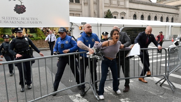 Police tackle pro-Palestinian protesters disrupting the arrivals for the 2024 Met Gala at the Metropolitan Museum of Art on May 6, 2024 in New York. Photographer: Andrea Renault/AFP/Getty Images