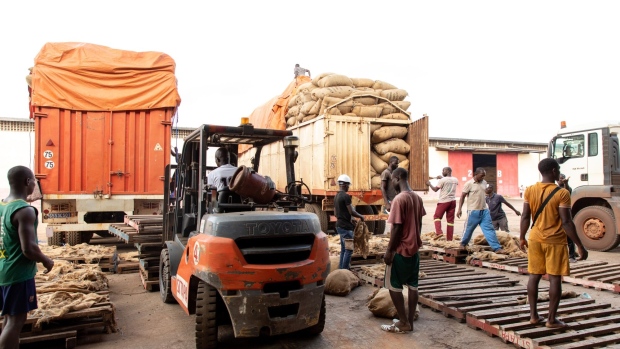 <p>Delivery trucks, carrying cocoa beans, outside a facility in San-Pedro, Ivory Coast.</p>