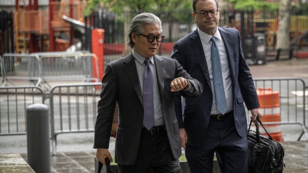 Bill Hwang, left, and attorney Barry Berke arrive at federal court in New York, on May 8.