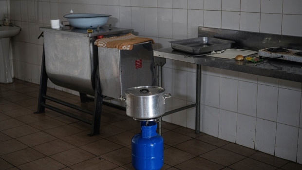 A gas stove used for cooking in a restaurant during a period of loadshedding in the township of Namahadi, Frankfort, South Africa, on Saturday, June 3, 2023. The rural town of Frankfort has returned into scheduled blackouts, following a court-issued ban sought by Eskom Holdings SOC Ltd. against Rural Free State (Pty) Ltd., who were easing loadshedding schedules for residents by providing power from a local photovoltaic solar plant. Photographer: Michele Spatari/Bloomberg
