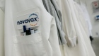 A Novavax logo on a lab coat at the company's facility in Gaithersburg, Maryland, US, on Wednesday, May 18, 2022. Novavax is confident its Covid-19 vaccine will receive the endorsement of the Food and Drug Administration’s advisory committee early this summer, executives said this week, reports CNBC. Photographer: Jon Cherry/Bloomberg