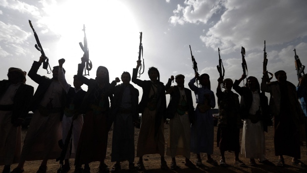 Yemen's Shiite Huthi rebels shout slogans during a gathering in Sanaa, Yemen. Photographer: Mohammed Huwais/AFP/Getty Images