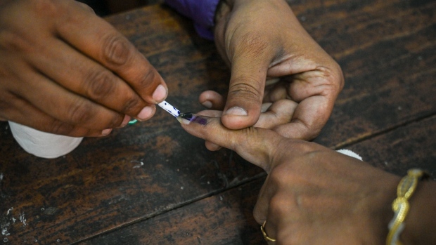 <p>A voter's finger is marked with indelible ink at a polling station in Kanpur, Uttar Pradesh, India.</p>