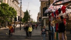 <p>Shoppers cross Gilbert Street in Central London, UK.</p>
