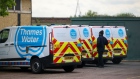 <p>Engineers' vans parked at a Thames Water pumping station in London.</p>