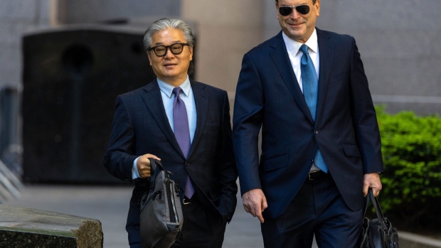 Bill Hwang, left, arrives at court in New York on May 20.