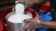 A baker measures refined sugar at a cafe’s kitchen in Negros Occidental, the Philippines, on Tuesday, April 30, 2024.
