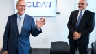 Glenn Chamandy, CEO of Gildan Activewear, left, and Michael Kneeland, the new board chair, spoke to reporters in Montreal on Tuesday.