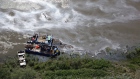 Crews work to clean up an oil spill on the North Saskatchewan river near Maidstone, Sask.