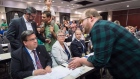A demonstrator confronts Montreal mayor Denis Coderre at the NEB Energy East hearing