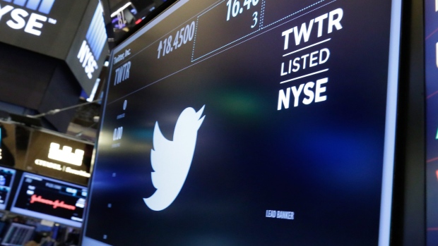 The Twitter symbol appears above a trading post on the floor of the New York Stock Exchange