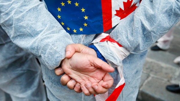 A protester against the EU trade deal with Canada, known as CETA