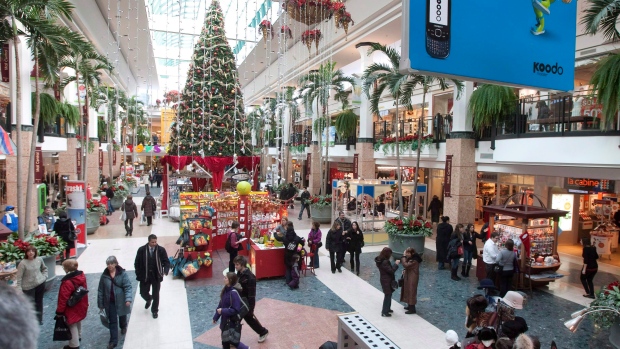 Christmas shoppers walk to stores at the Laurier shopping centre in Quebec City