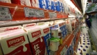 Milk produced by Bright Food is displayed for sale on shelves at a supermarket in Shanghai