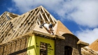 A construction worker works on a new house being built in Vaughan, Ontario