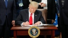 Donald Trump signs an executive order for border security and immigration enforcement improvements.