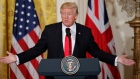 President Donald Trump gestures during a joint news conference with British PM Theresa May