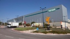 trucks drive in front of Teva Pharmaceutical Logistic Center in the town of Shoam, Israel